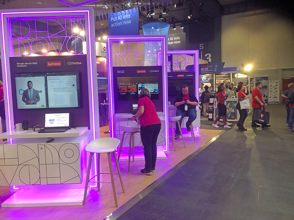 An overview over some booths at the HPC exhibition, also showing some visitors.