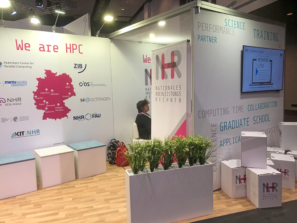 A picture of the sofa corner at the NHR Alliance booth at a conference.