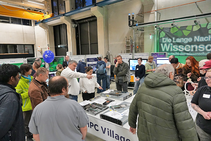 This image captures a wide view of a very busy indoor exhibition, likely a 